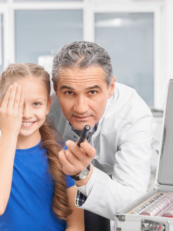girl-closing-eye-with-hands-and-looking-at-camera-in-clinic-1.jpg